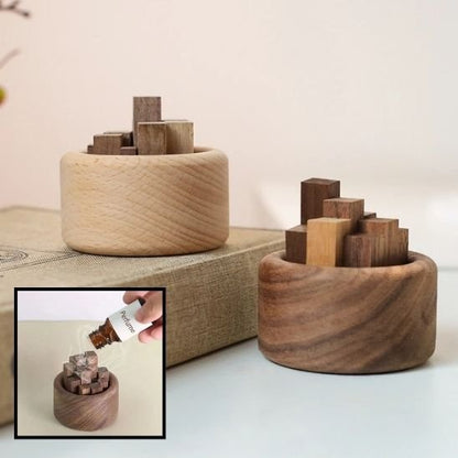 Diffuseur huile essentielle présenté sur livre et application huile essentielle